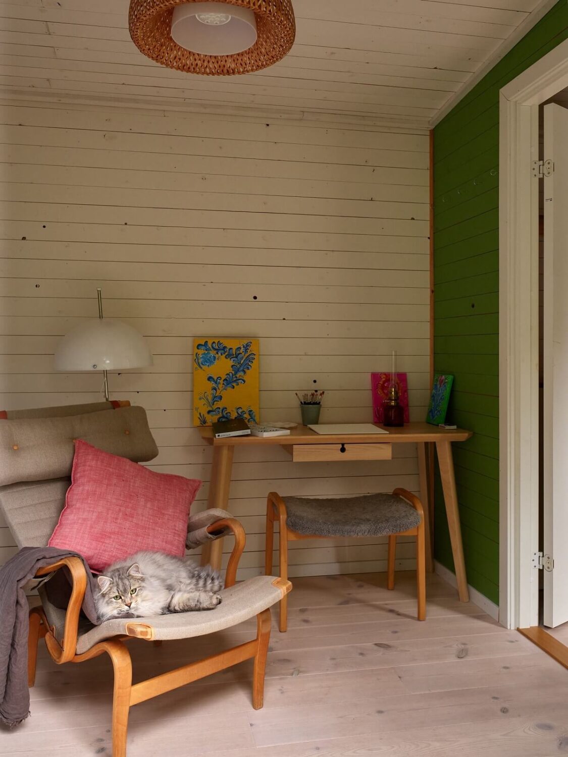 A Charming Swedish Cottage Filled with Art and Color 20 bedroom with desk