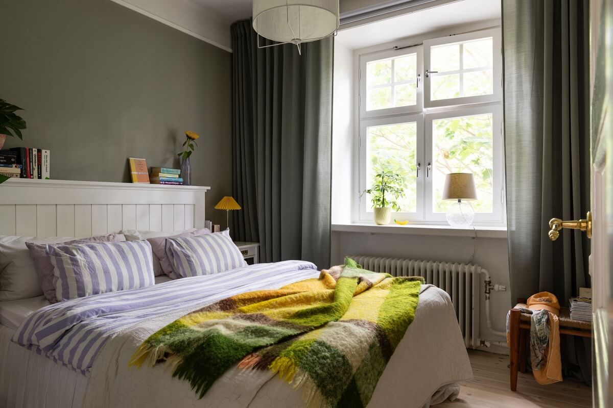 Soft Colors in a Charming Corner Apartment in Stockholm 8 bedroom with green and yellow accent colors