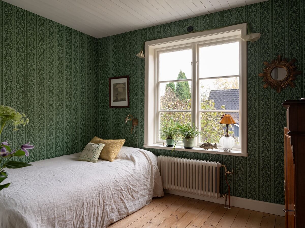 A 1930s Green-Painted Wooden Family Home in Sweden 21 bedroom with green wallpaper