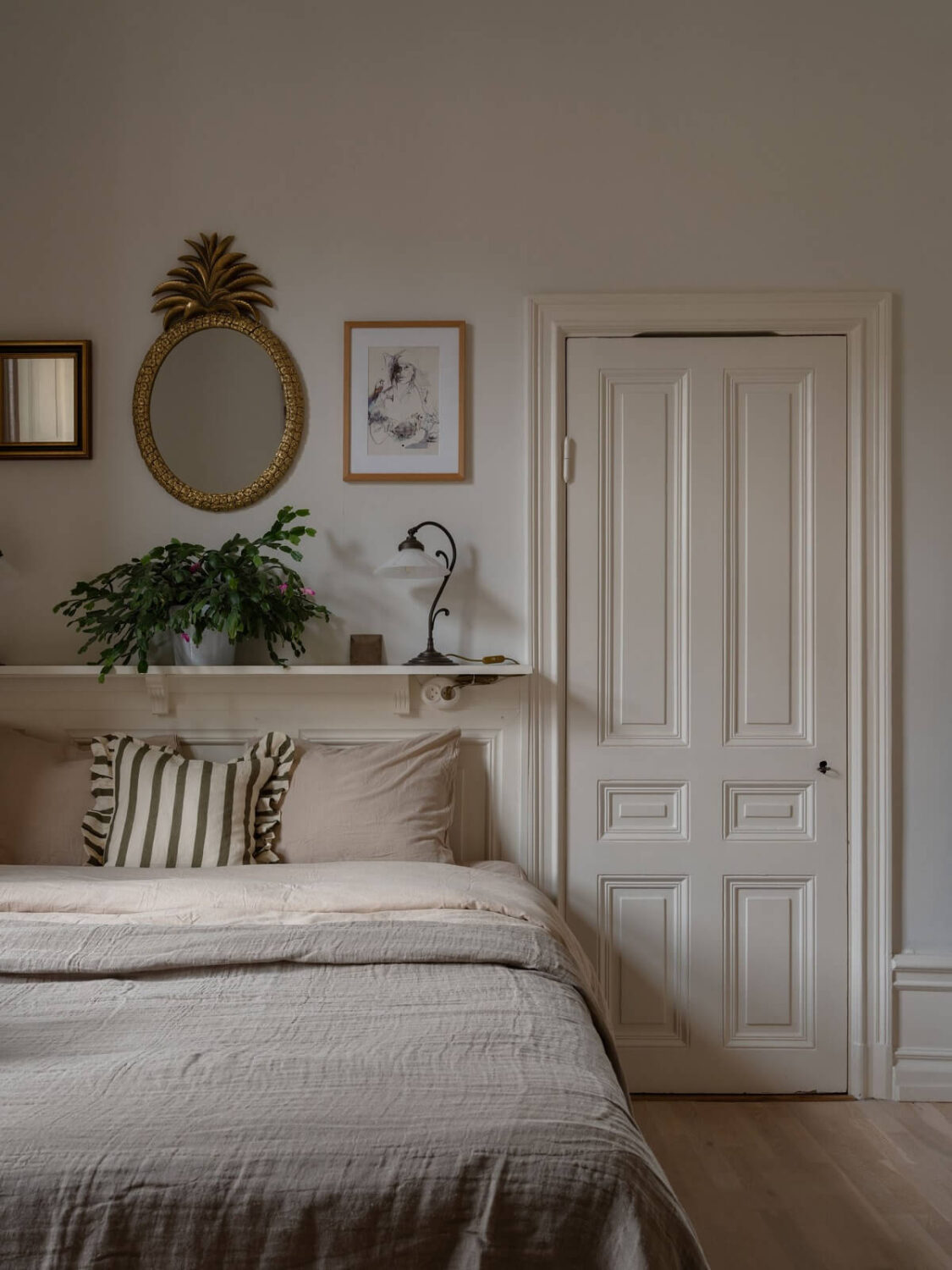 A Swedish Maisonette with Period Features and Modern Solutions 13 bedroom with shelf above bed