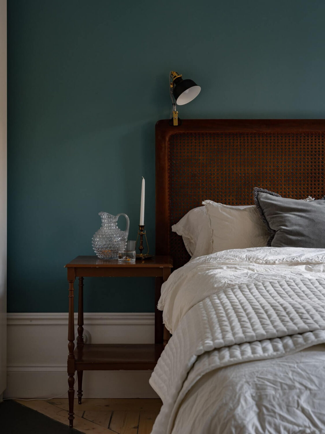 An 1890s Stockholm Apartment with a Blue Bedroom 11 bedroom with teal blue walls and cane headboard