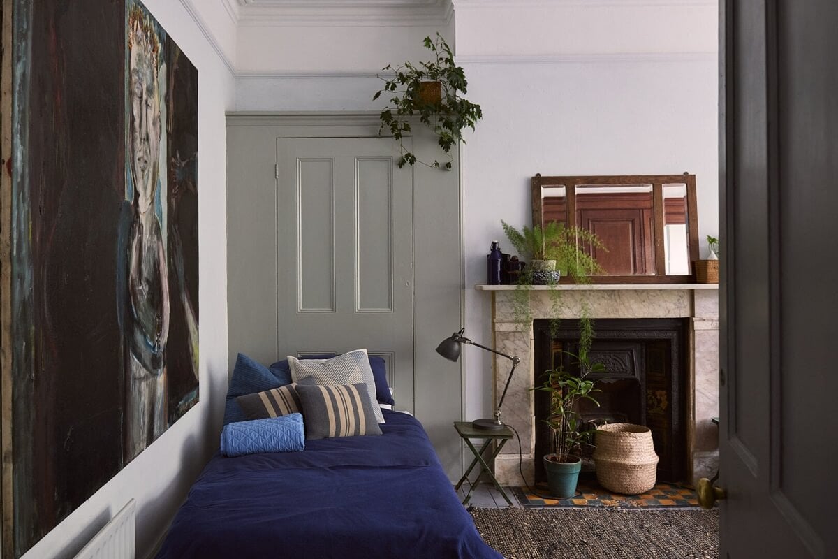A Grand Victorian House with Many Period Features and a Lush Garden 14 bedroom wth blue couch and fireplace