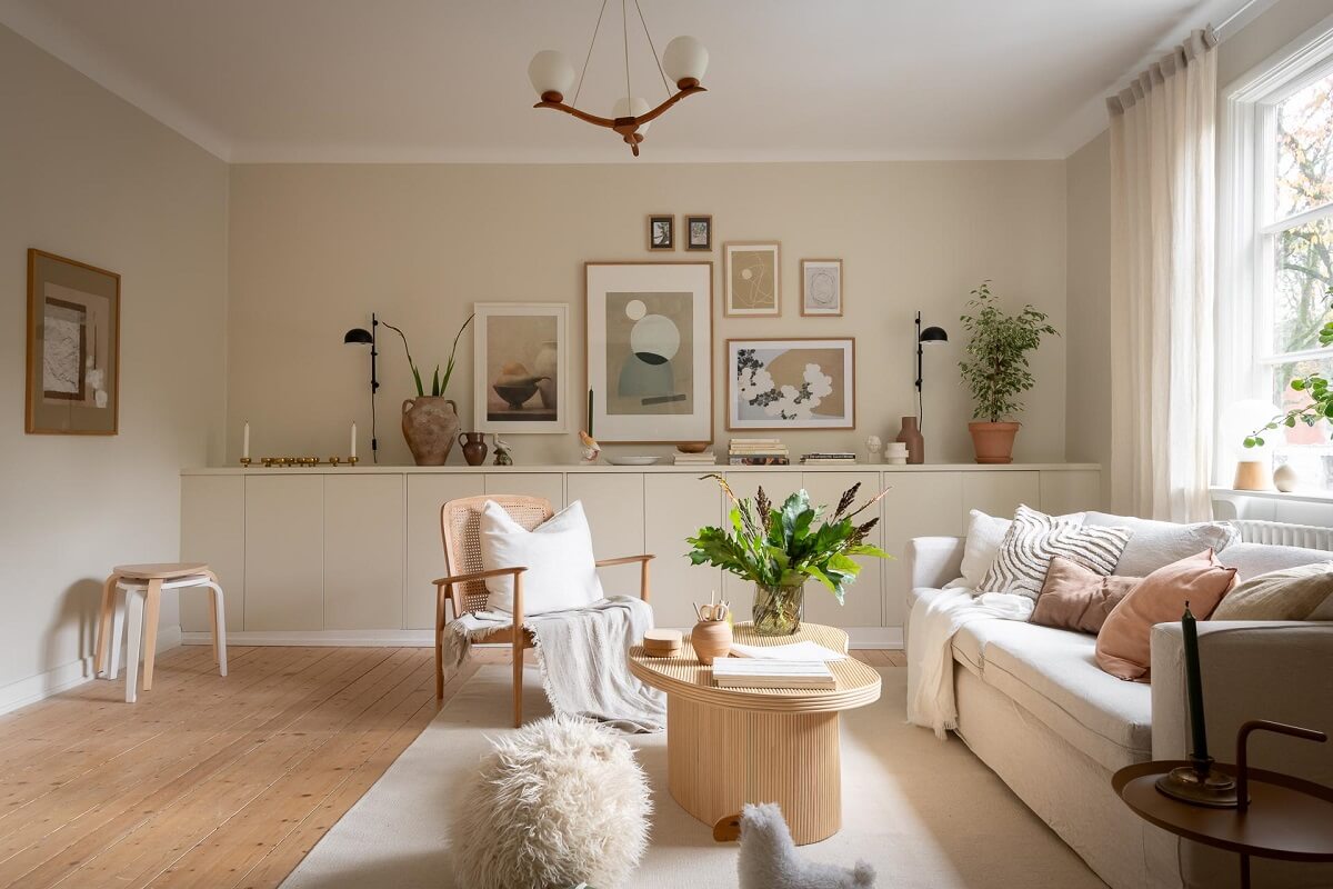 A Swedish Apartment Painted in Calm Beige, Green, and Pink Tones 1 beige living room custom fitted cabinets