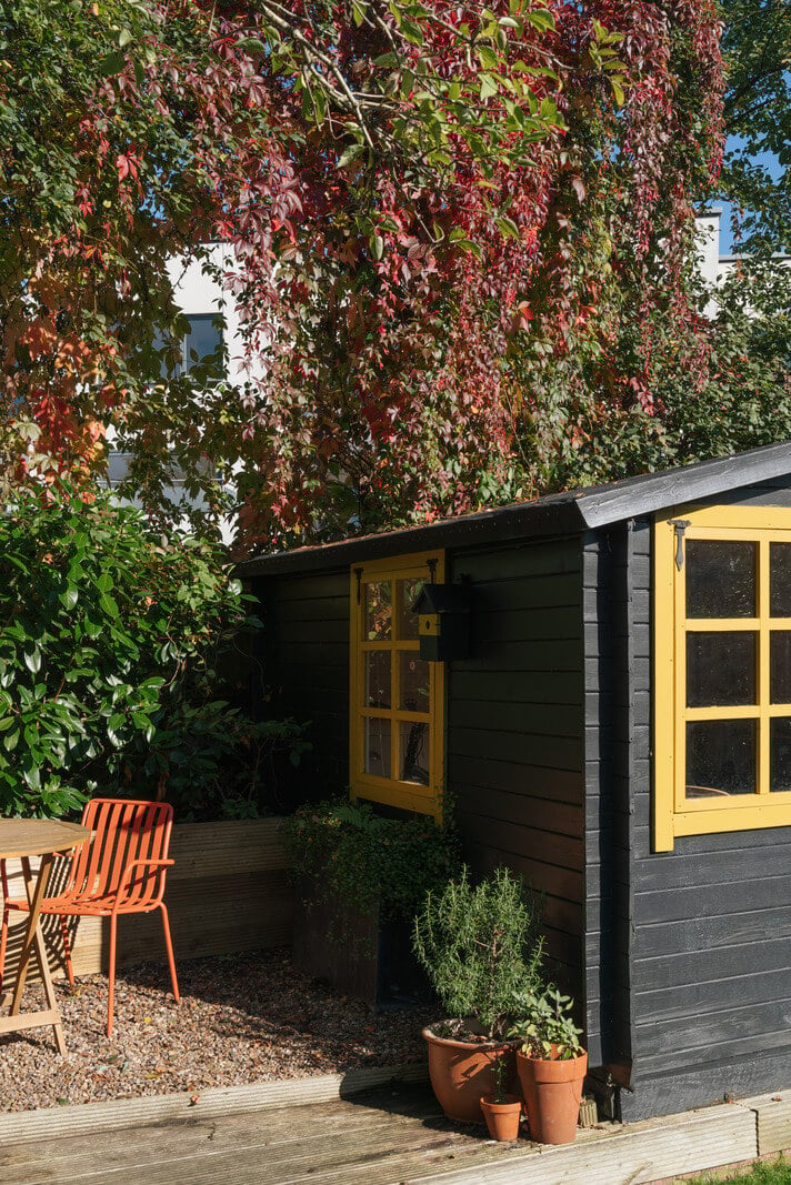 Colorful Rooms and Period Features in a London Terrace House 23 black garden shed yellow windows