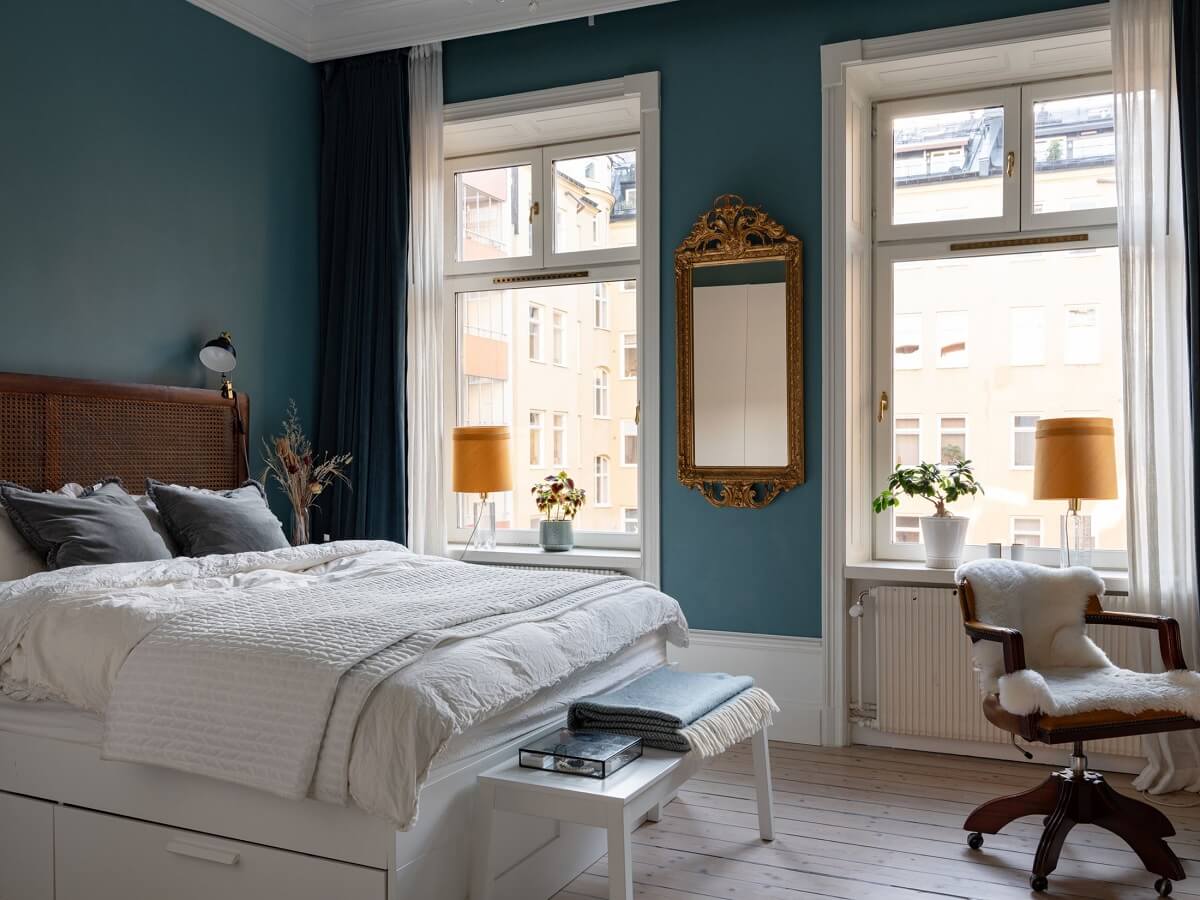 An 1890s Stockholm Apartment with a Blue Bedroom 7 blue bedroom walls gilded mirror