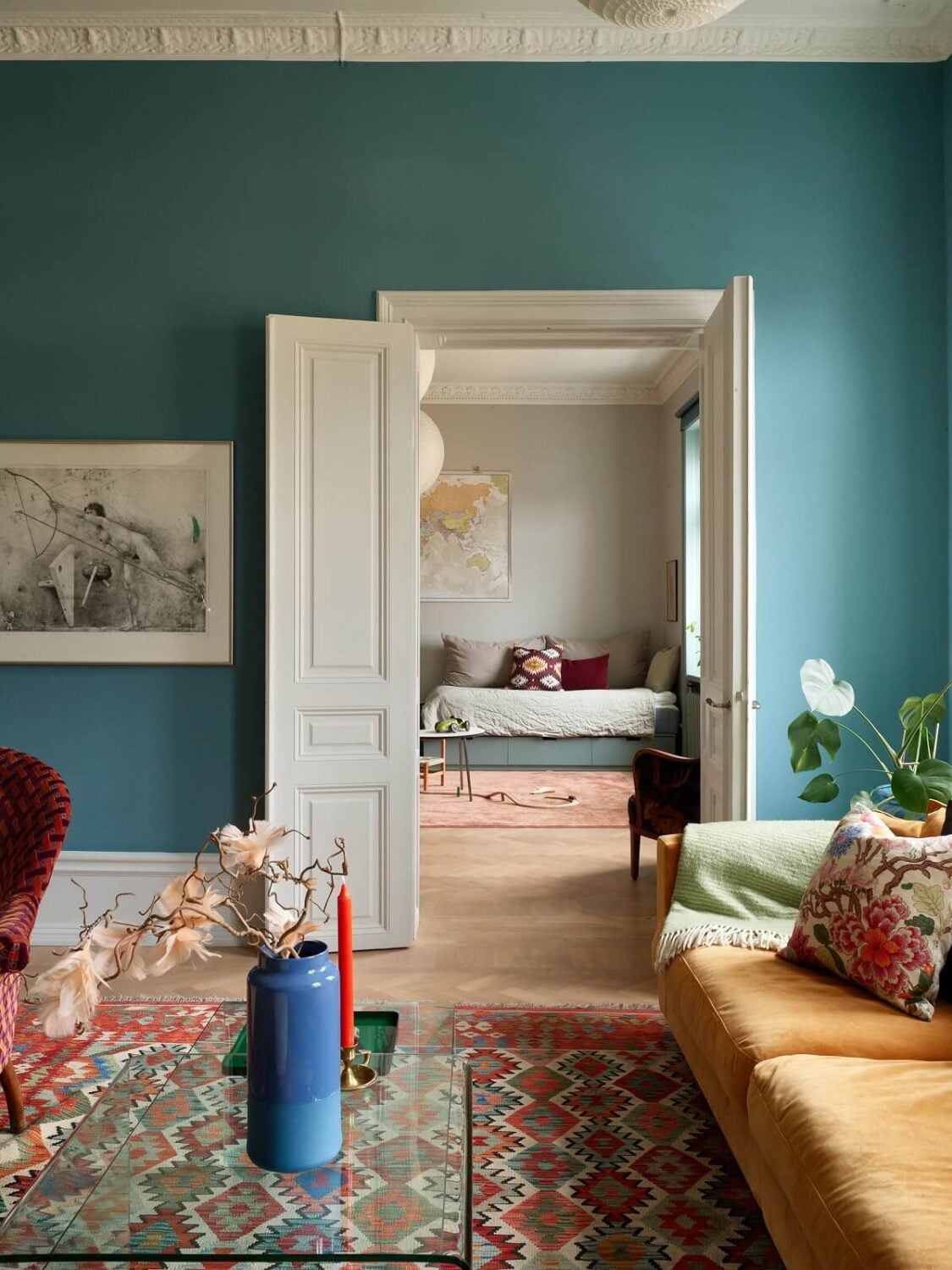 A Colorful Turn-of-the-Century Family Apartment in Stockholm 7 blue living room double wooden doors to childrens room