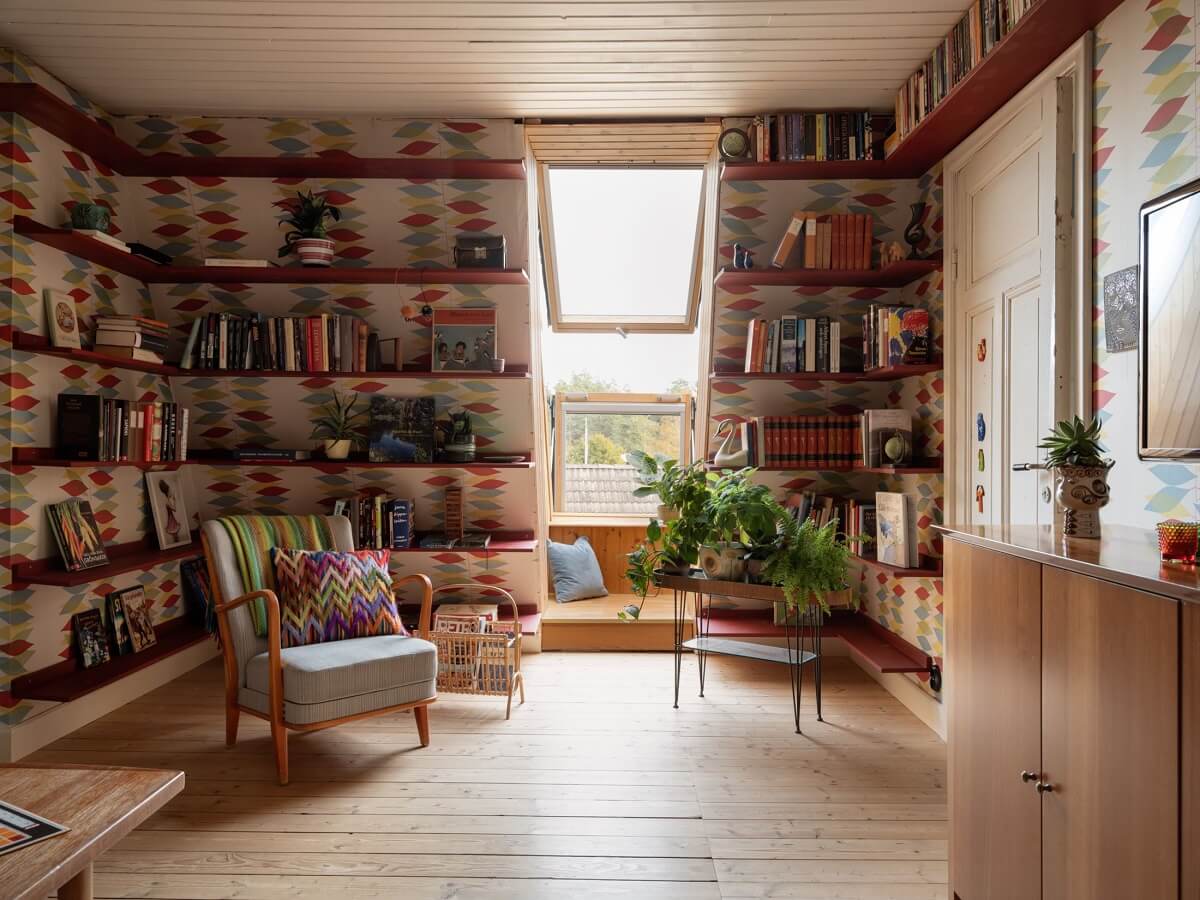 A 1930s Green-Painted Wooden Family Home in Sweden 15 bookshelves and colorful wallpaper living room