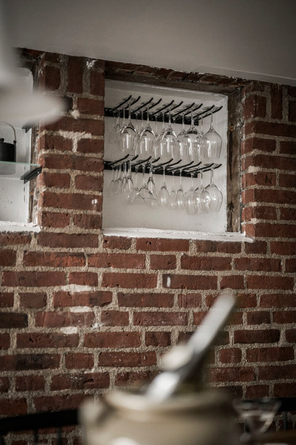 A Scandinavian Loft in an Old Industrial Building 13 brick wall niches for wine glass storage