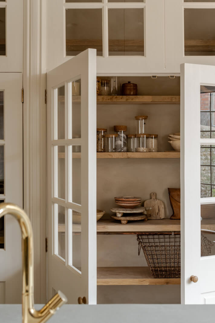 Limewash Walls and Restored Period Features in a Calm English Home 7 built in kitchen cabinets with glass doors