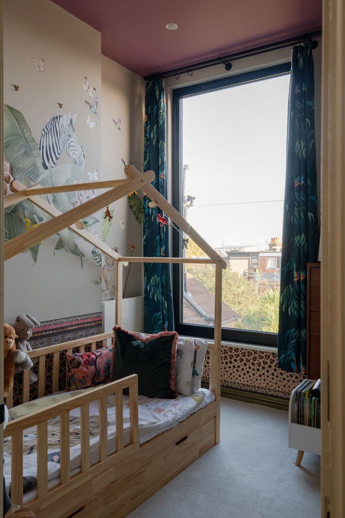 A Colorful Edwardian Family Home in London 18 childrens room with pink ceiling
