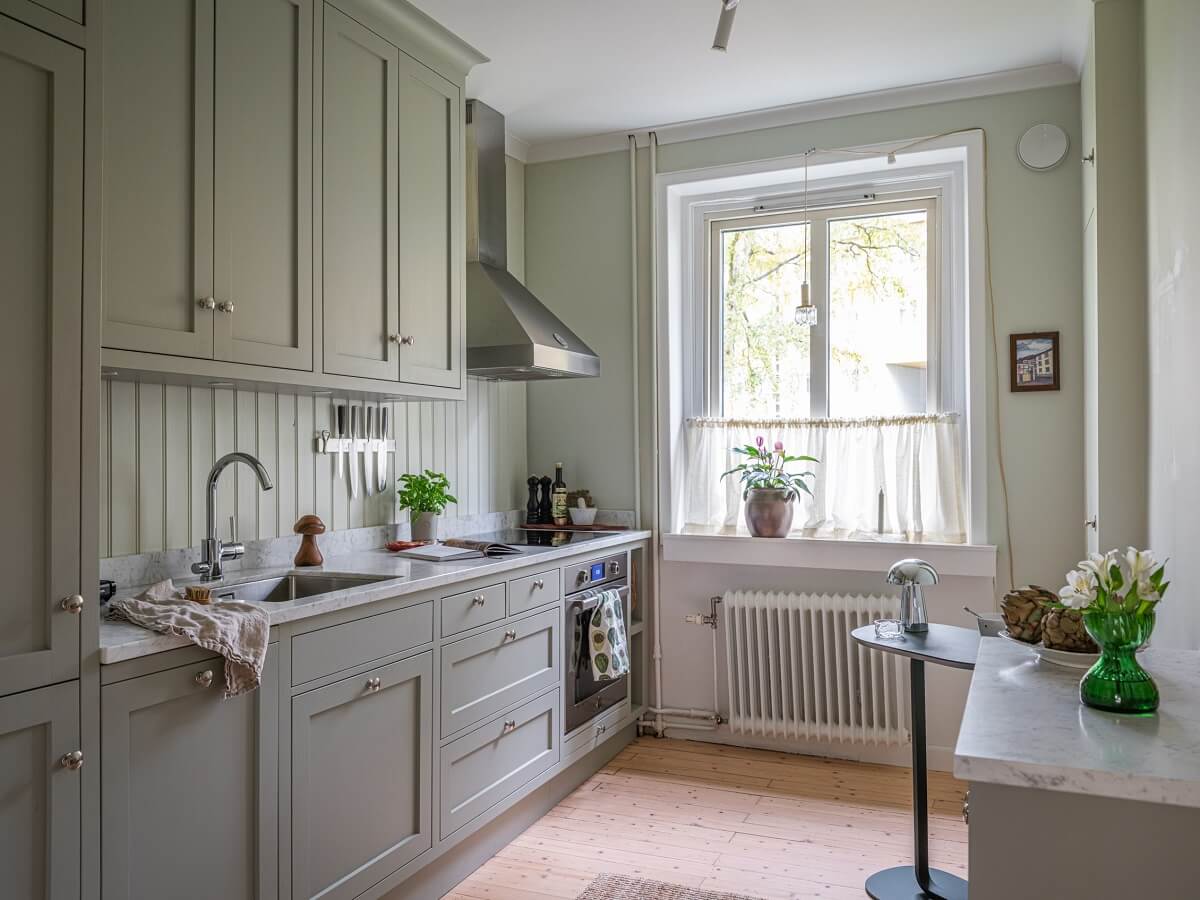 A 1930s Apartment with Gray Rooms and Period Features 7 classic kitchen gray cabinets