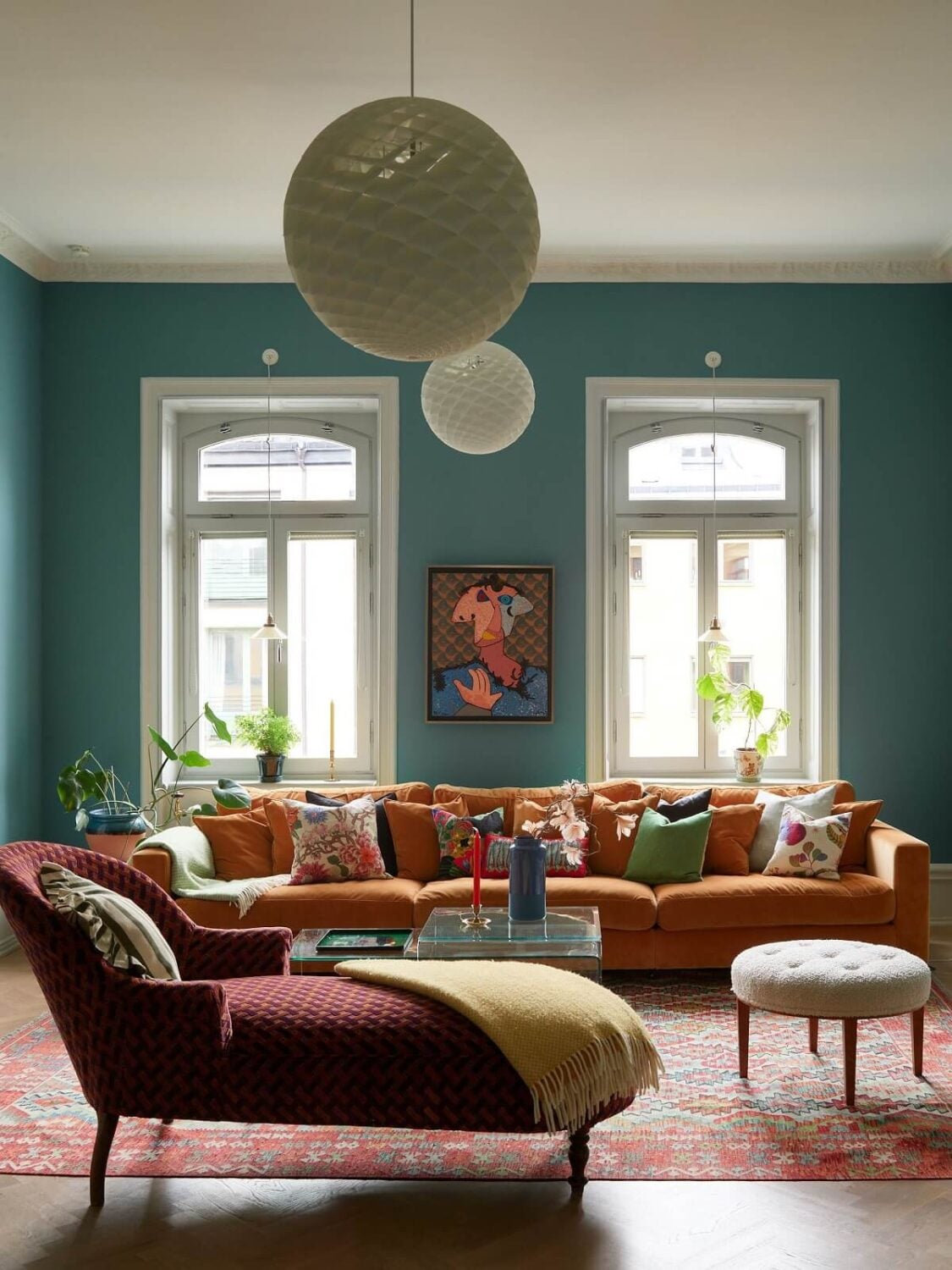 A Colorful Turn-of-the-Century Family Apartment in Stockholm 2 colorful furniture and daybed in blue living room
