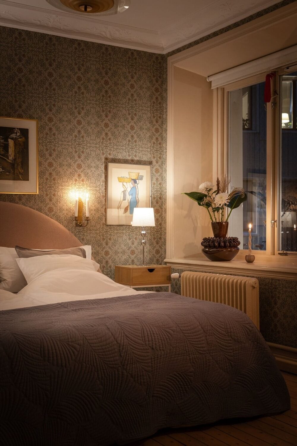 A Stately Apartment with Period Details and Wallpapers 14 cozy bedroom with round headboard and wallpaper A Stately Apartment with Period Details and Wallpapers