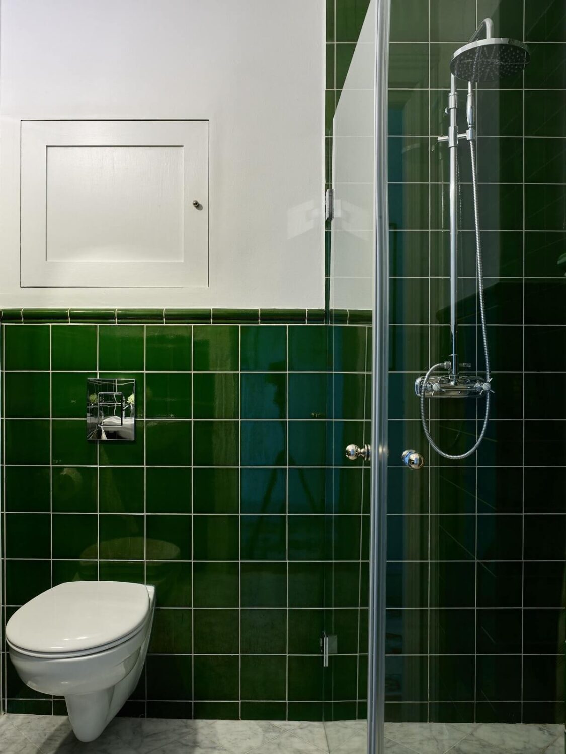 A Colorful Turn-of-the-Century Family Apartment in Stockholm 36 dark green tiles small bathroom