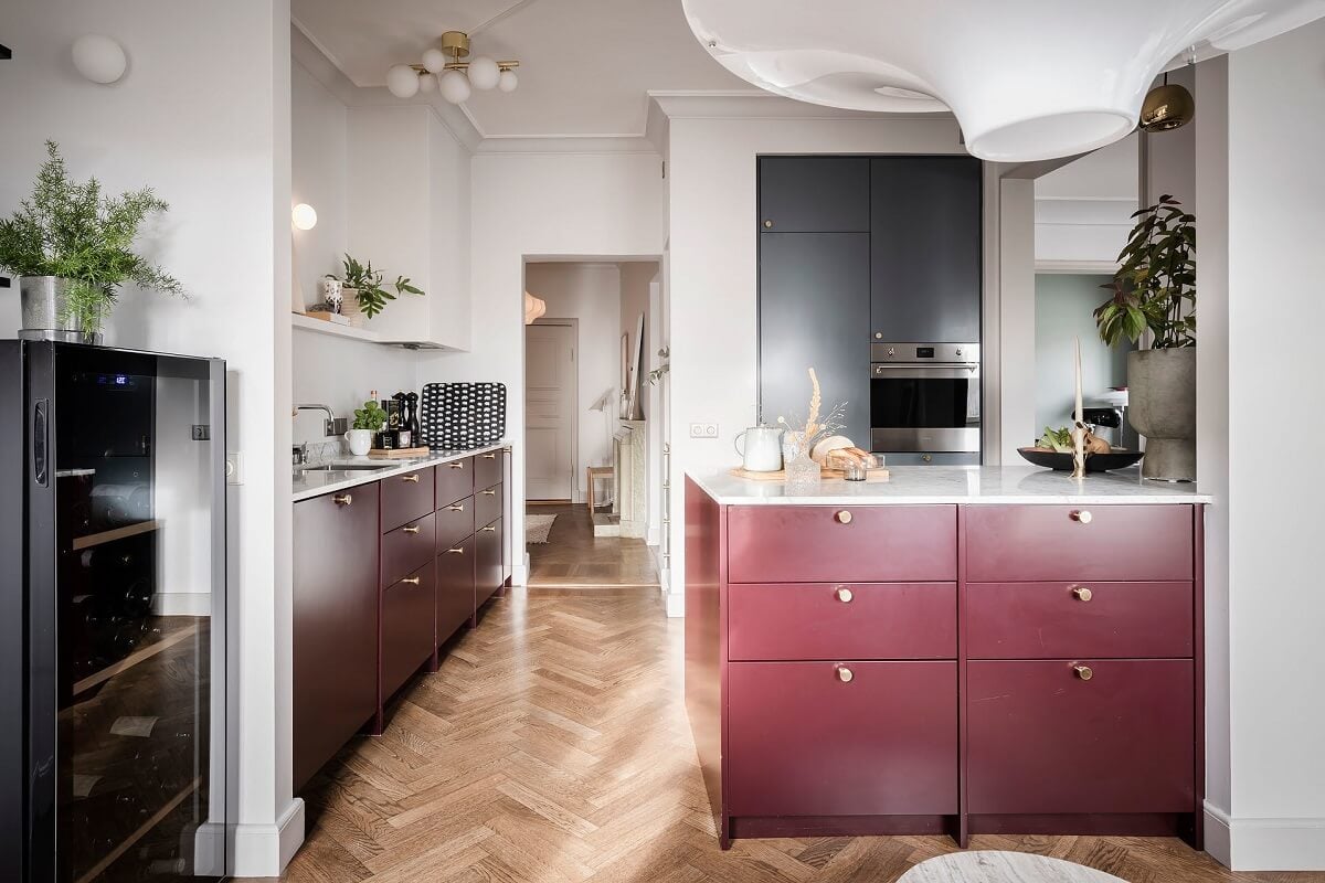 A Burgundy Kitchen in a Stylish Scandinavian Apartment 15 dark pink kitchen cabinets with drawers