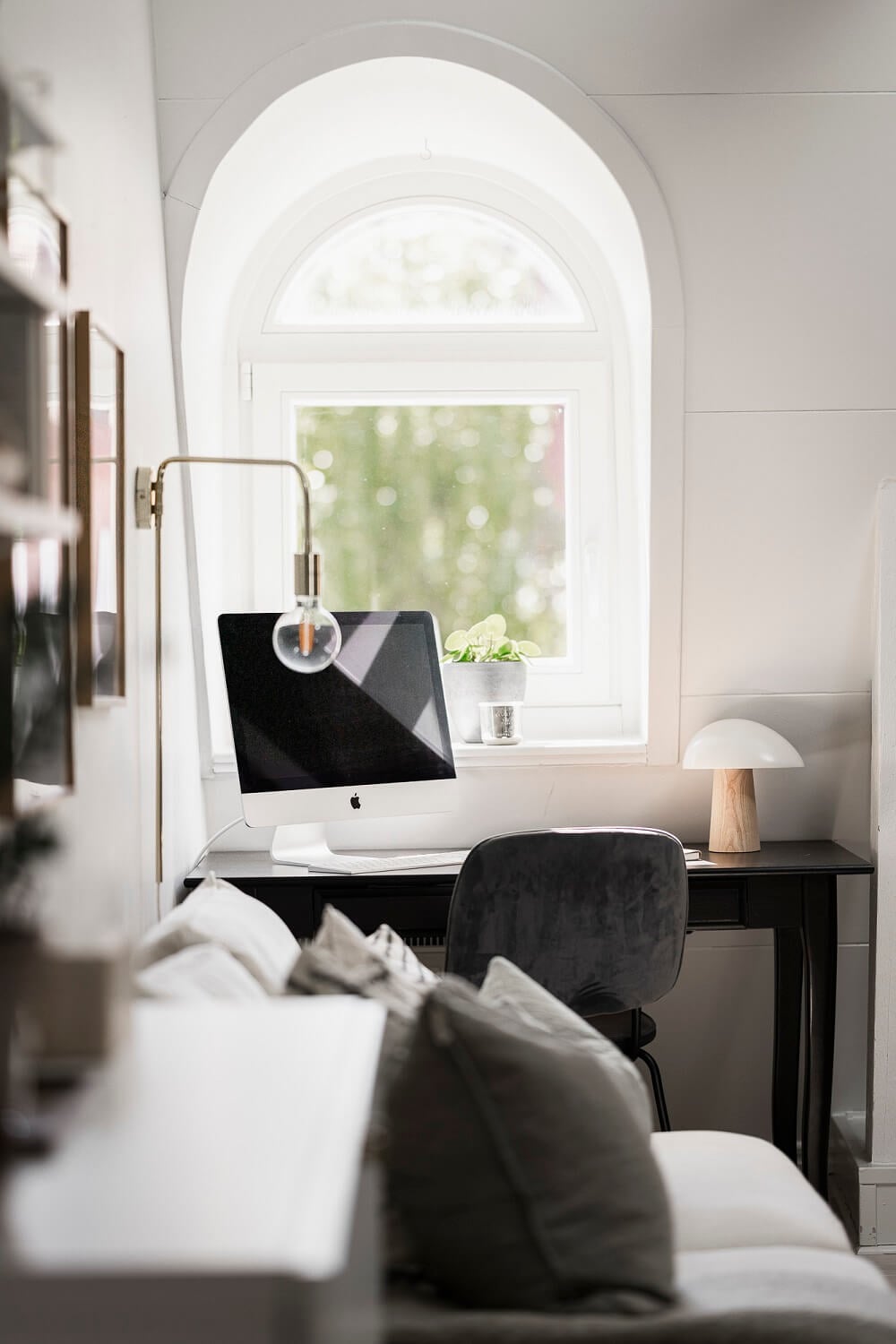 A Swedish Attic Apartment with a Lovely Balcony Overlooking the City 11 desk under dormer window