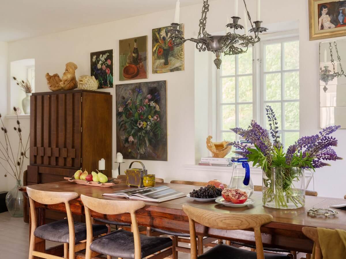 A Bohemian-Style House on the Estate of a Swedish Castle 5 dining room large wooden table art