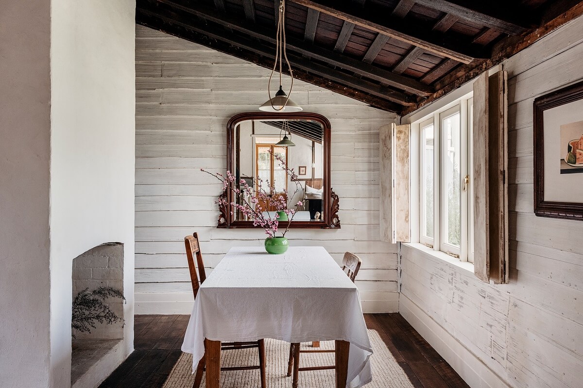 A Cozy Rustic Shipbuilder's Cottage in Northern Tasmania 5 dining room white walls and rustic wooden ceiling