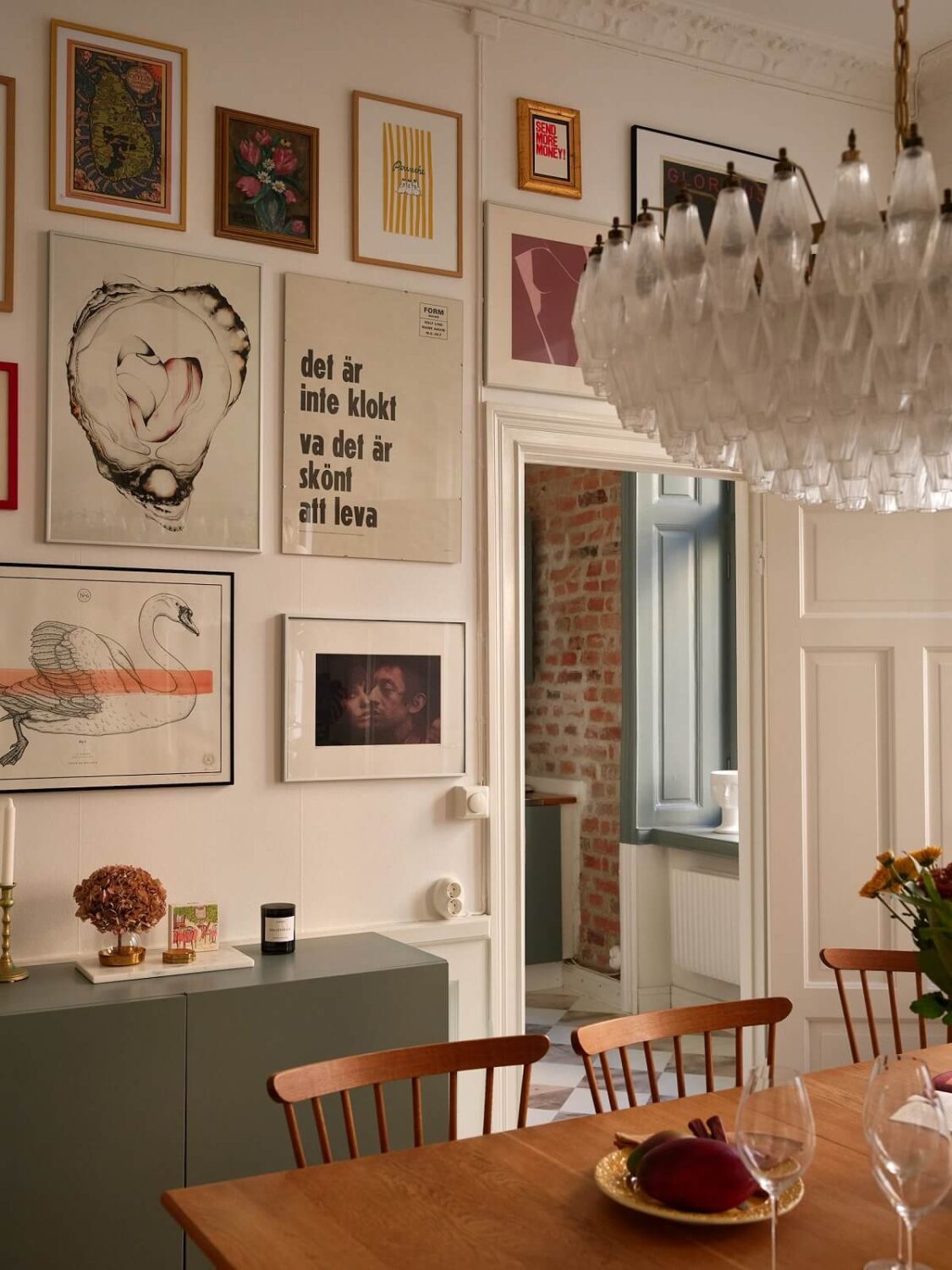 A Light Corner Apartment with 1890s Period Features 6 dining room with gallery wall