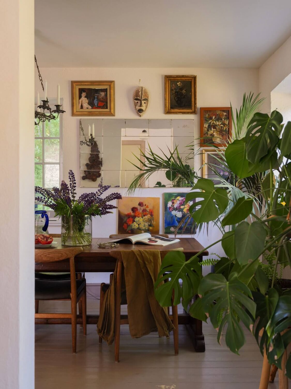 A Bohemian-Style House on the Estate of a Swedish Castle 6 dining room with gallery wall