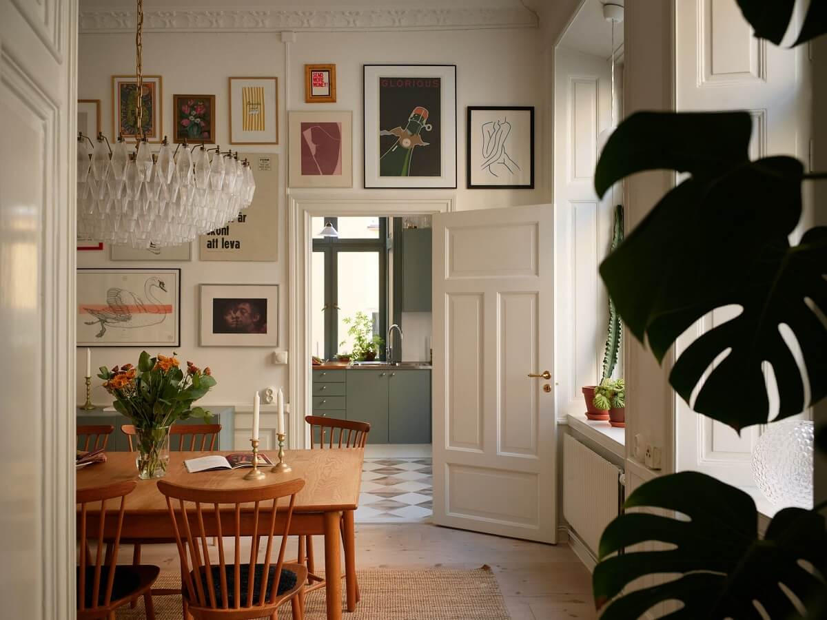 A Light Corner Apartment with 1890s Period Features 1 dining room wooden table gallery wall