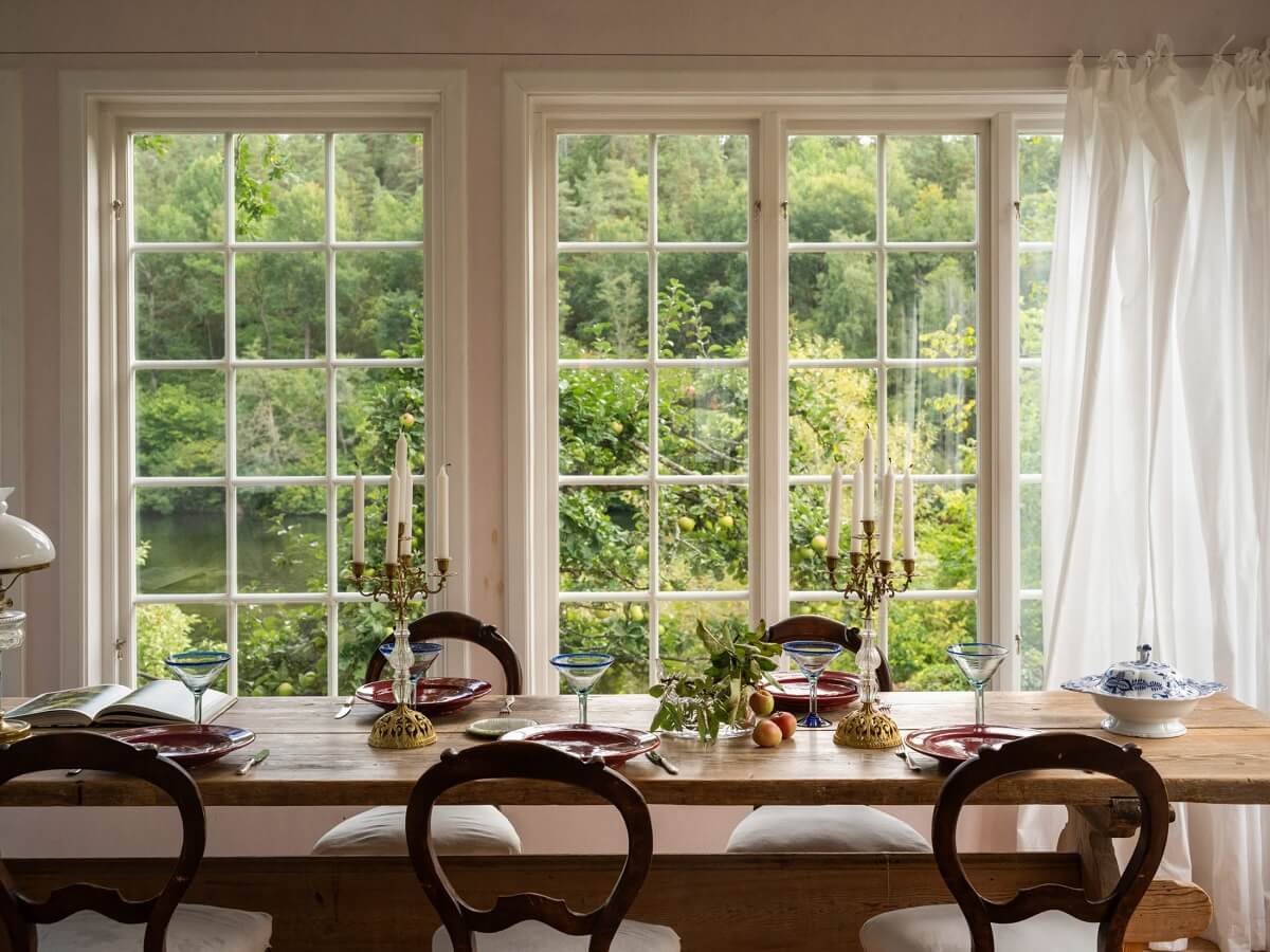A Romantic 1920s Villa with Views of the Lake 7 dining table by window