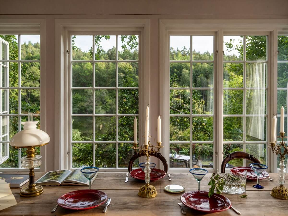 A Romantic 1920s Villa with Views of the Lake 9 dining table with green views