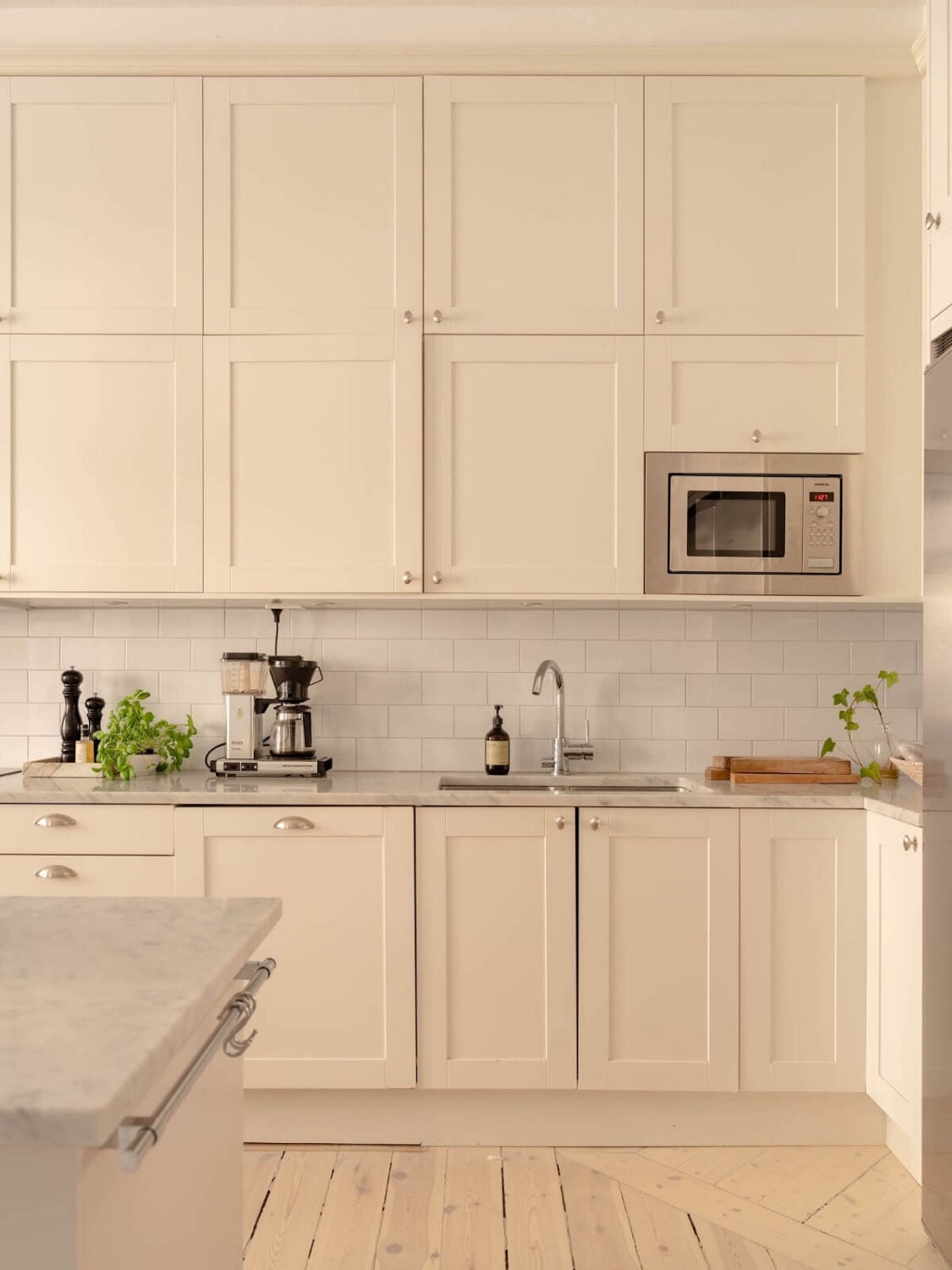 A Spacious Stockholm Apartment with Light Gray Walls 14 double kitchen cabinets