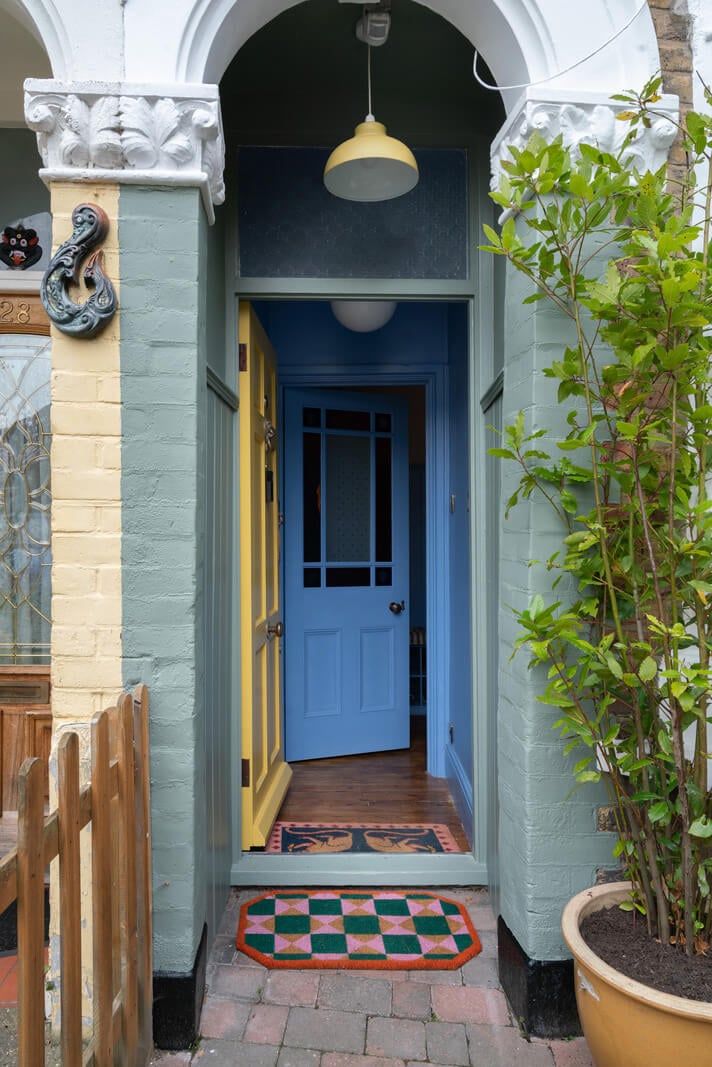 Colorful Rooms and Period Features in a London Terrace House 24 entry yellow door blue hallway Colorful Rooms and Period Features in a London Terrace House