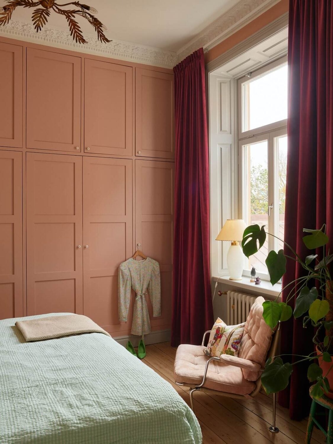A Colorful Turn-of-the-Century Family Apartment in Stockholm 21 floor to ceiling wardrobes pink bedroom