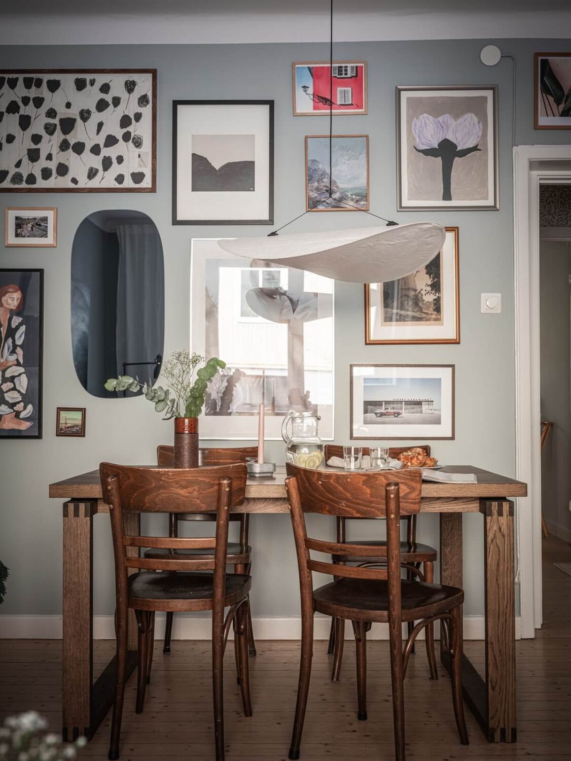 A 1930s Apartment with Gray Rooms and Period Features 6 gallery wall dining table