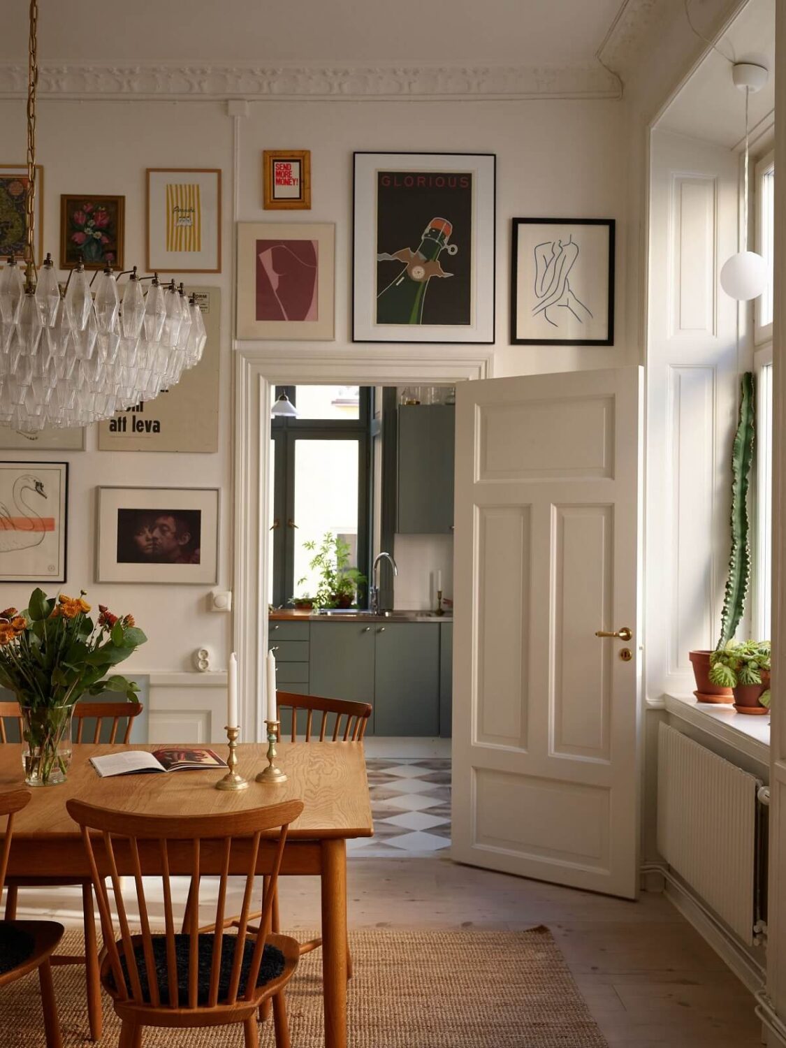 A Light Corner Apartment with 1890s Period Features 2 gallery wall in dining room