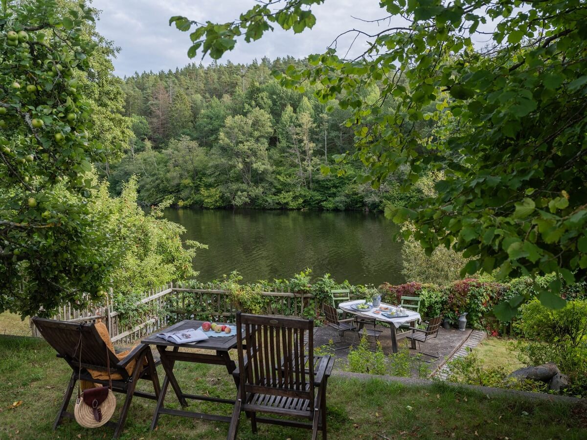 A Romantic 1920s Villa with Views of the Lake 23 garden canal view A Romantic 1920s Villa with Views of the Lake