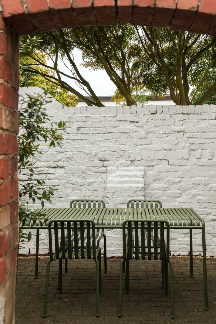 Contemporary Light Interiors in a 19th-Century English Cottage 17 garden dining table brick wall