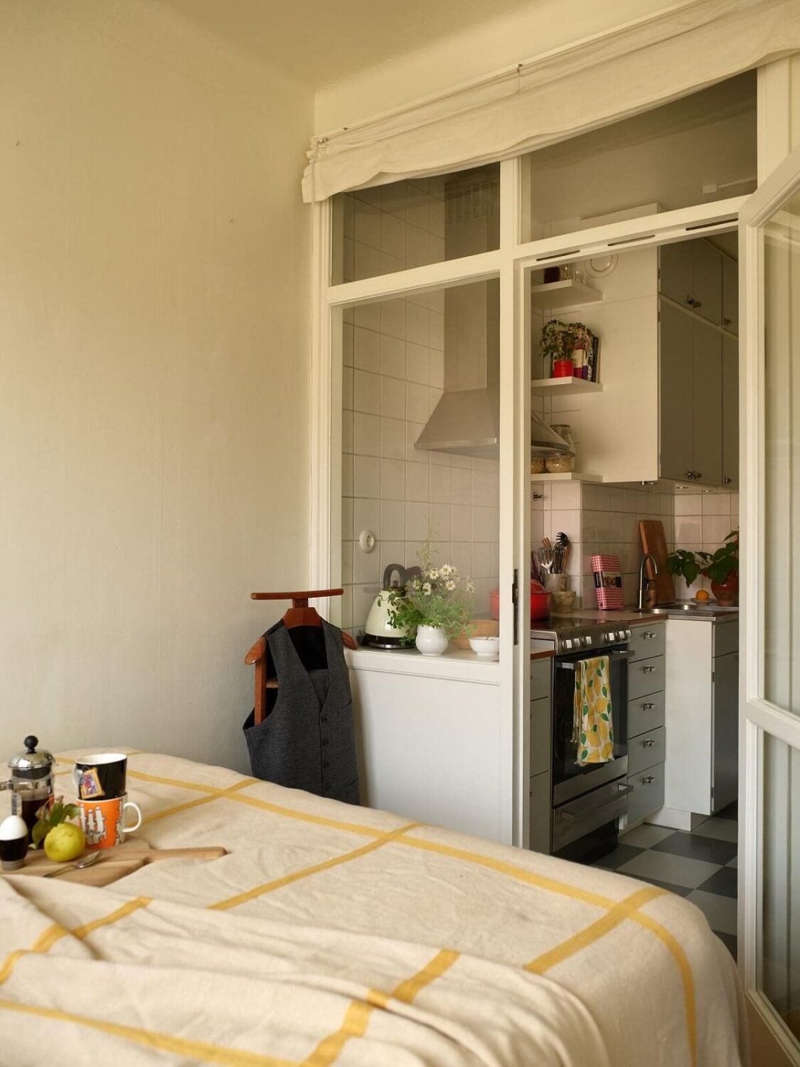 A Small 1930s Swedish Apartment with a Yellow Floral Hall 12 glass wall narrow bedroom