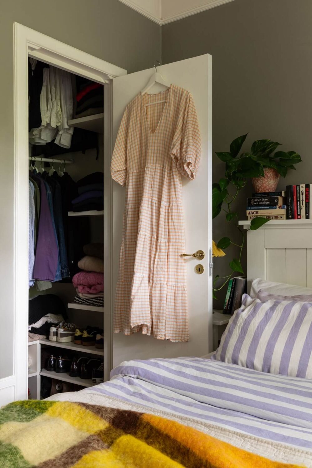 Soft Colors in a Charming Corner Apartment in Stockholm 12 gray bedroom with built in closet