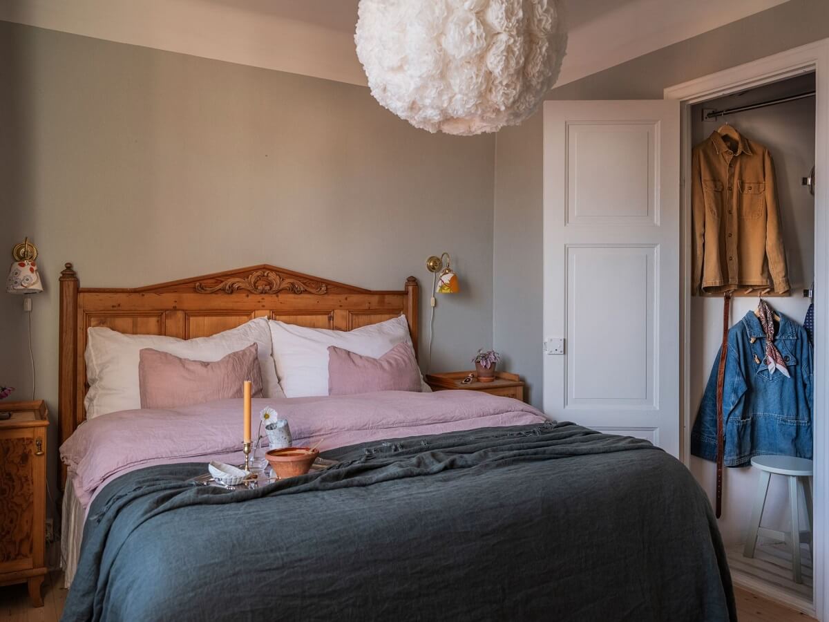 A Living Room with Light Purple Walls in a Swedish Apartment 12 gray bedroom with wooden bed