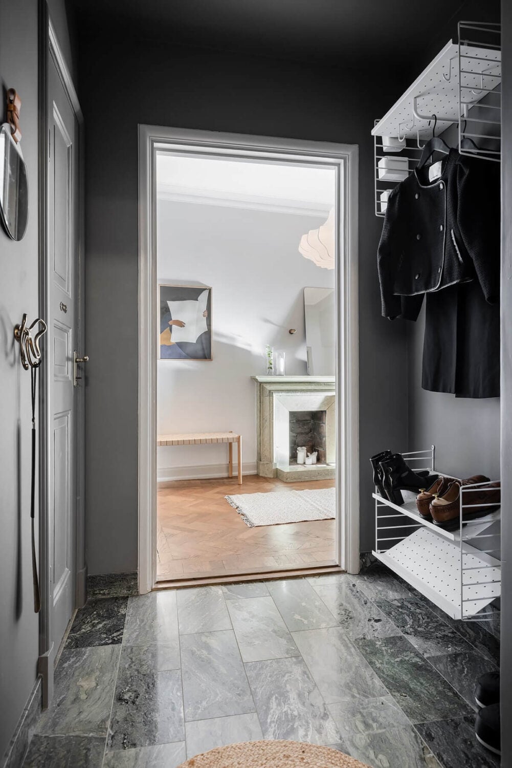 A Burgundy Kitchen in a Stylish Scandinavian Apartment 29 gray hallway