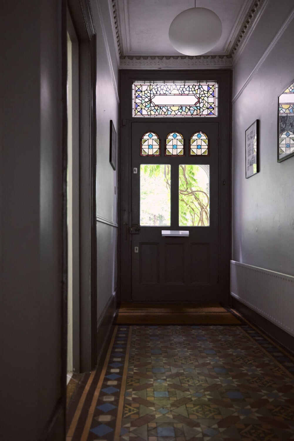 A Grand Victorian House with Many Period Features and a Lush Garden 12 gray hallway with original floor tiles