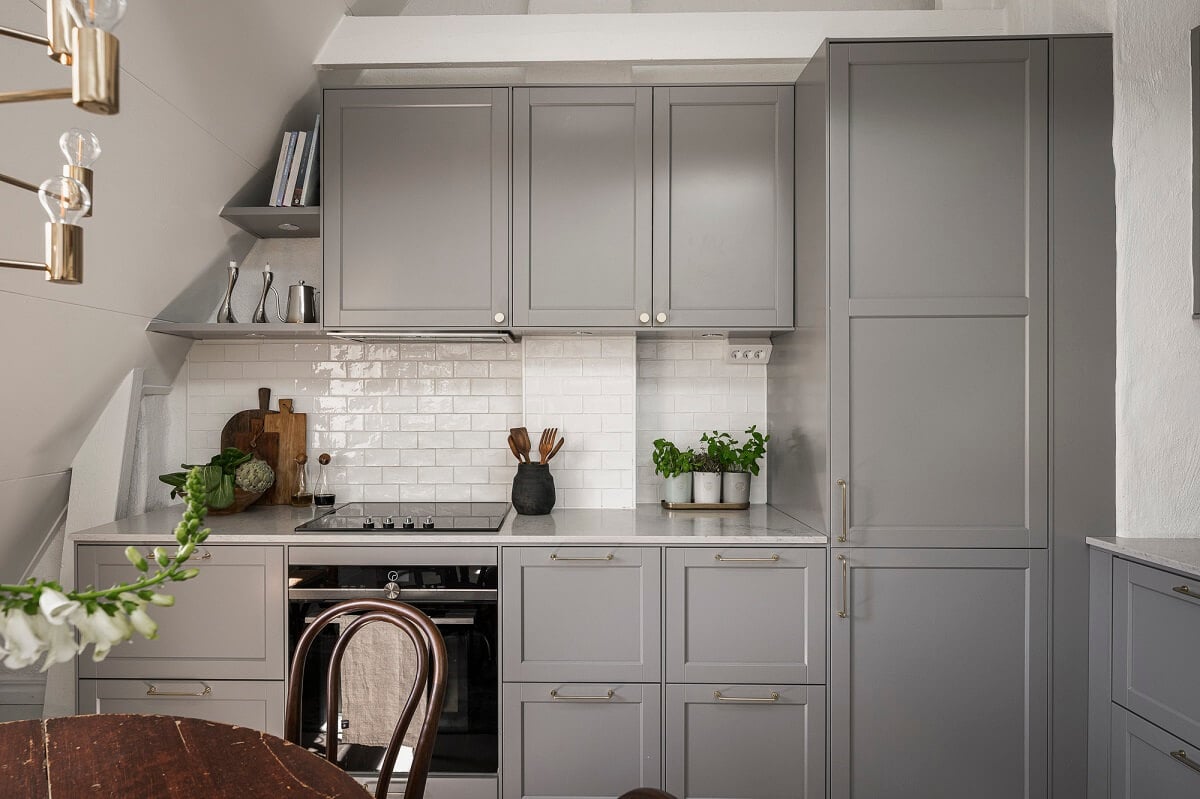 A Swedish Attic Apartment with a Lovely Balcony Overlooking the City 5 gray kitchen attic apartment sweden
