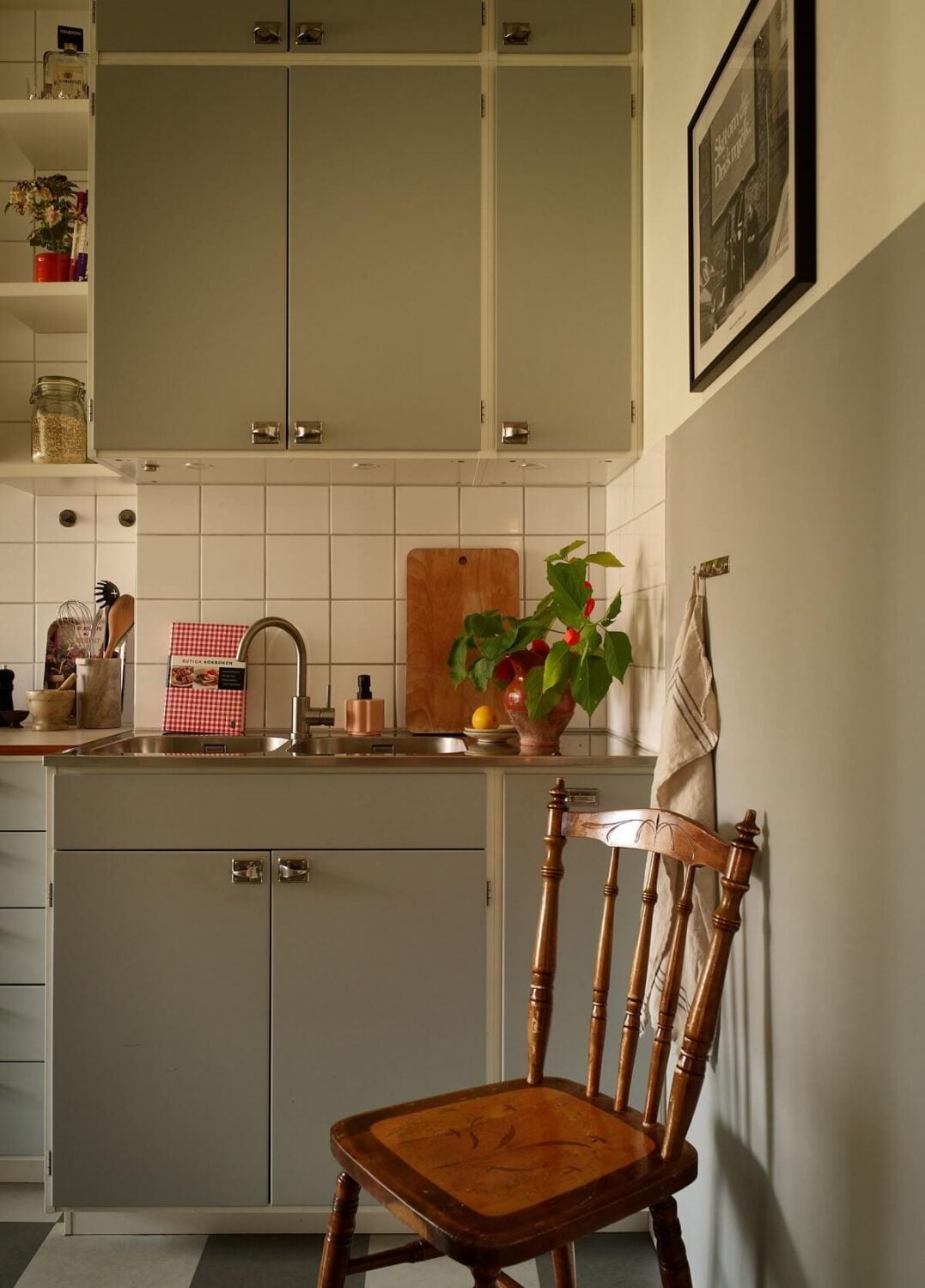 A Small 1930s Swedish Apartment with a Yellow Floral Hall 7 gray midcentury kitchen cupboards
