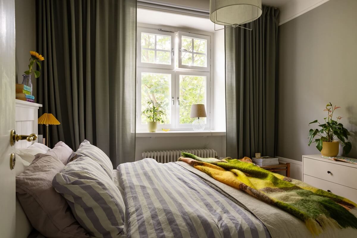 Soft Colors in a Charming Corner Apartment in Stockholm 11 gray scandi bedroom