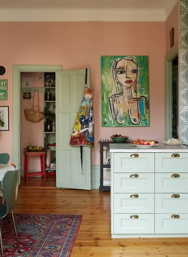 Best of 2024: Kitchens 2 green and pink kitchen with large table Best of 2024: Kitchens