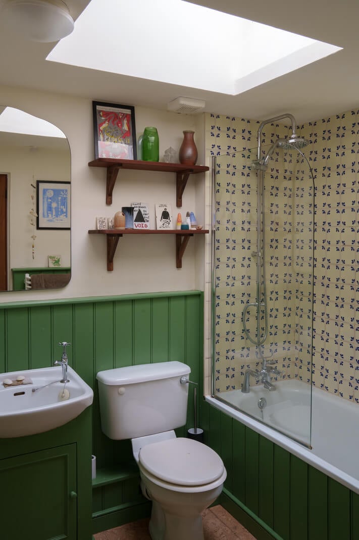 Colorful Furniture in a Historic English Cottage 15 green bathroom with skylight