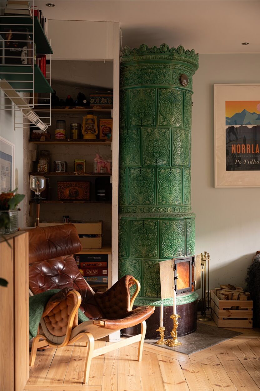 Green Tones in a Turn-of-the-Century Stockholm Apartment 10 green fireplace and storage niche with shelves