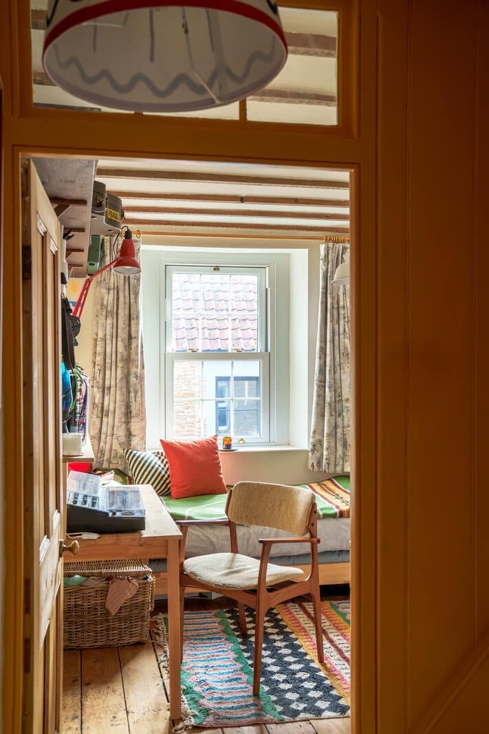 Colorful Furniture in a Historic English Cottage 10 guest room office wooden beams