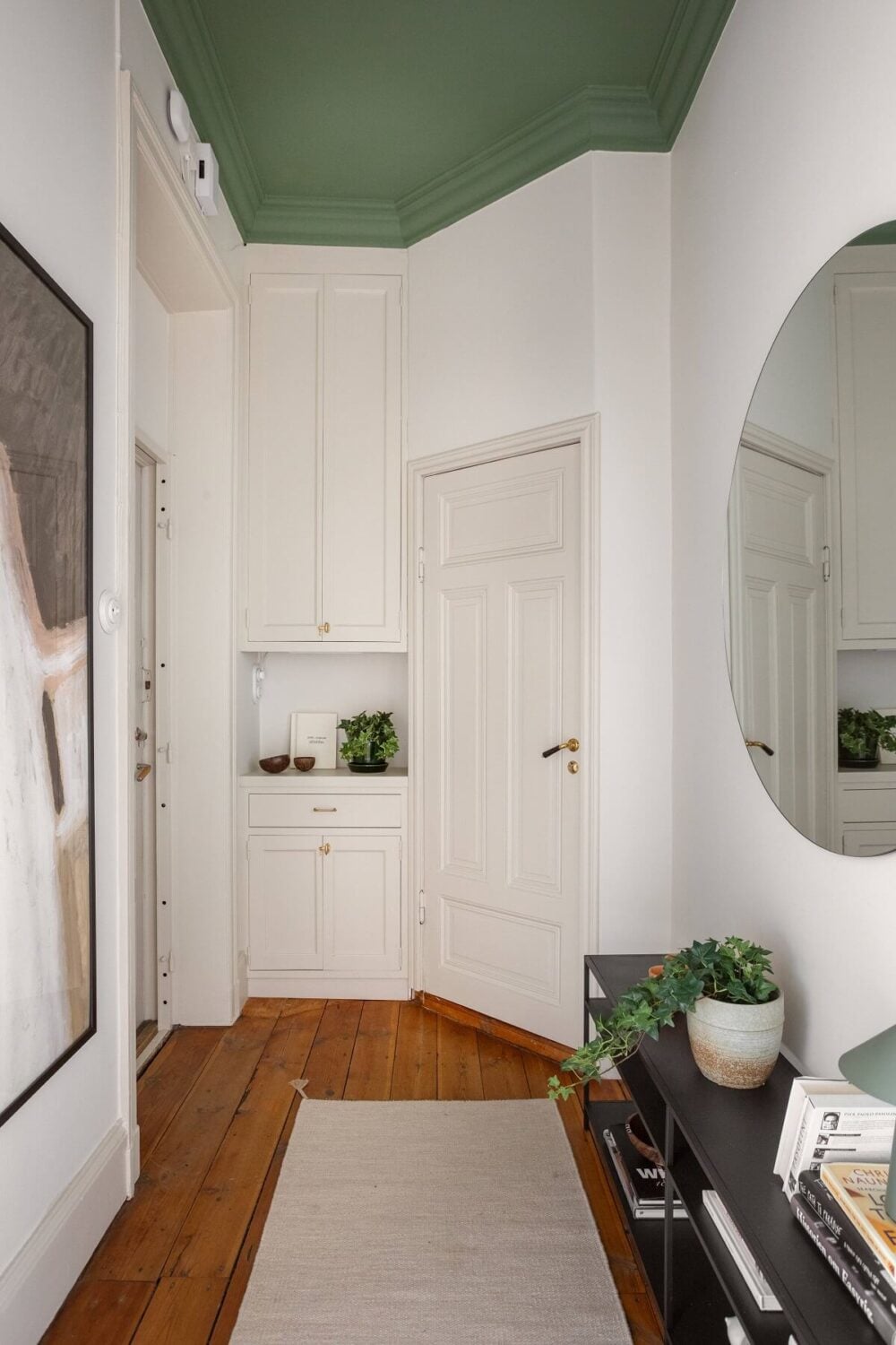 A Turn-of-the-Century Apartment with Warm Open-Plan Spaces 22 hall with green painted ceiling