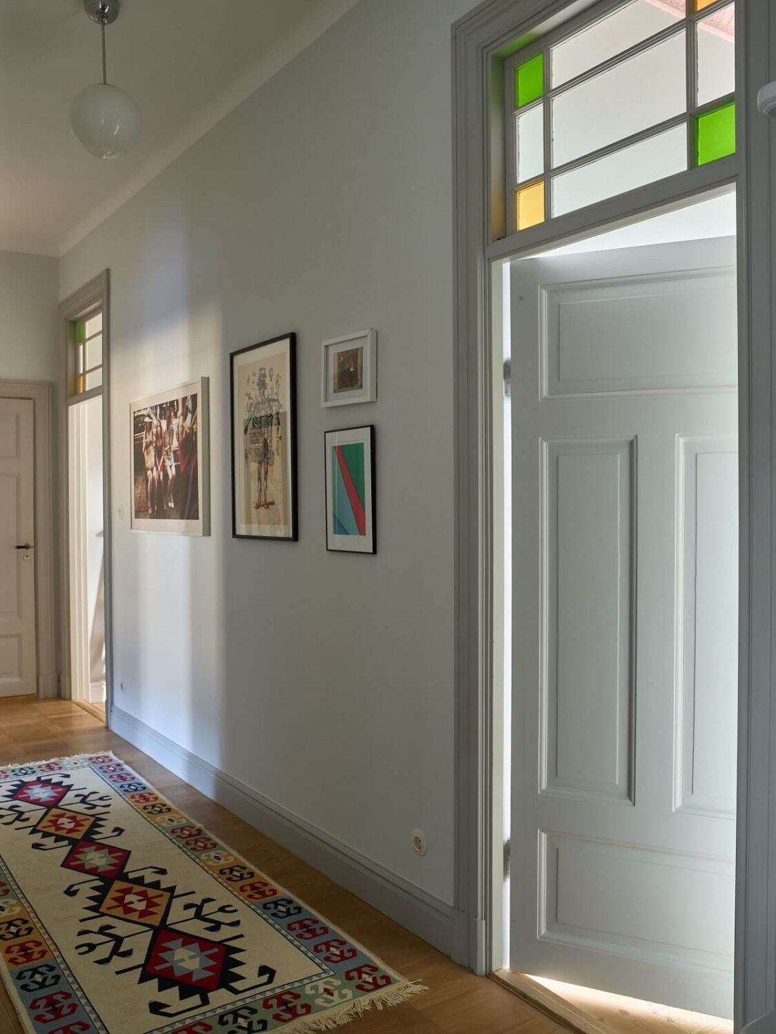 A Colorful Turn-of-the-Century Family Apartment in Stockholm 31 hallway colorful glass windows