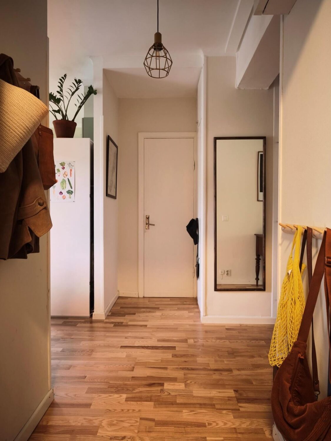A Small Swedish Apartment with a Social and Semi-Open Floorplan 20 hallway wall mirror