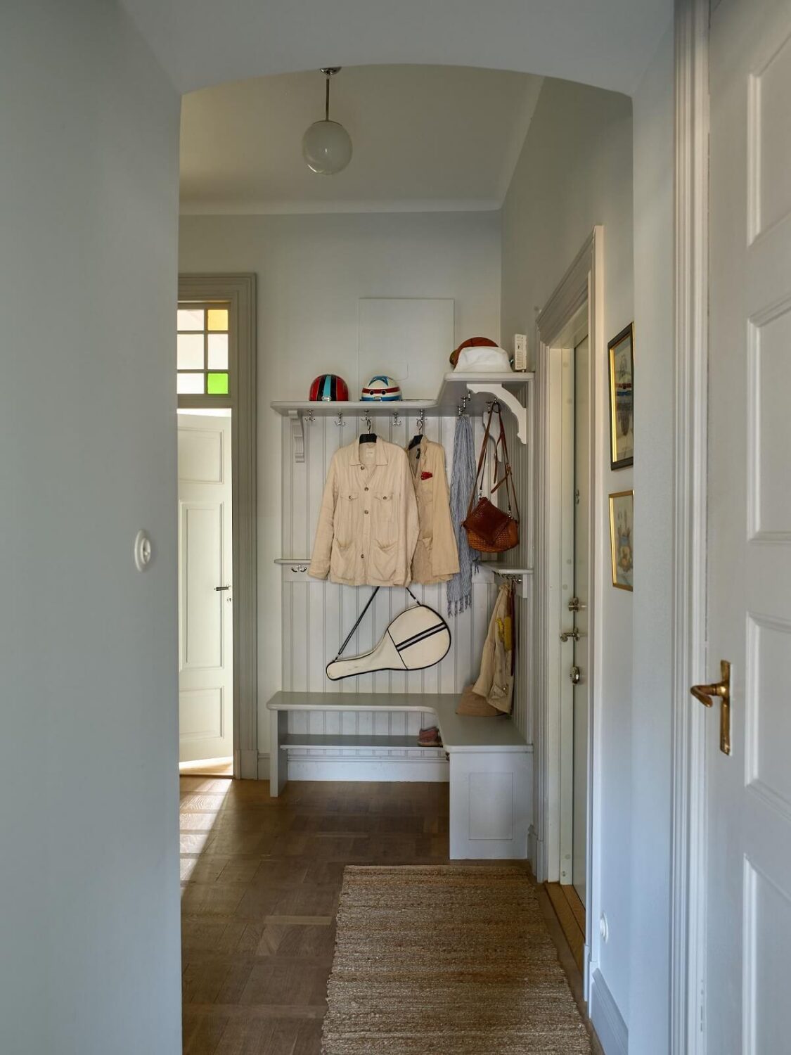 A Colorful Turn-of-the-Century Family Apartment in Stockholm 37 hallway with coat storage and bench A Colorful Turn-of-the-Century Family Apartment in Stockholm